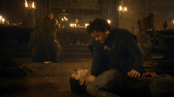 Robb holds his dying wife, while his mother, Catelyn, holds hostage a Frey girl