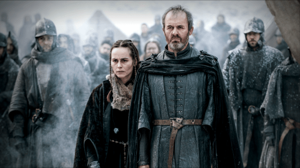 Stannis and his wife look on as their daughter burns